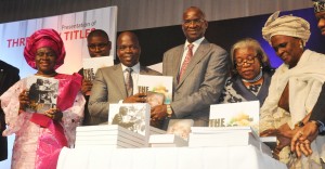 BRF (5th right), the Author and Special Adviser on Media to the Governor, Mr Hakeem Bello (6th left), Co-Author, Mr. Dapo Adeniyi (5th left), Chief Judge of Lagos State, Justice Funmilayo Atilade (4th right), former Deputy Governor of Lagos State, Alhaja Lateefat Okunnu (3rd right), representative of the National Leader of the All Progressives Congress, Asiwaju Bola Ahmed Tinubu & former Commissioner for Education in Lagos, Professor Tunde Samuel (left), Professor Fabian Ajogwu (3rd left) former Commissioner for Commerce and Industry in Ogun State, Otunba Bimbo Ashiru (2nd right), Opeluwa of Lagos, Chief Lateef Ajose (right) and the Oloris of the Oba of Lagos, Olori Titilola Akiolu (2nd left) and Olori Olanike Akiolu (4th left) presenting the book to the public during the  launch of three New Titles 