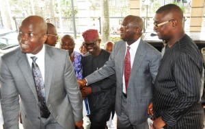 The immediate past Governor of Lagos State, Mr. Babatunde Fashola, SAN (2nd right) being welcomed by the author and Special Adviser on Media to the Governor, Mr Hakeem Bello (left), Co-Author, Mr. Dapo Adeniyi (right), during the launch of three New Titles – The Great Leap, In Bold Print and The Lagos Blow Down, edited by Hakeem Bello and Dapo Adeniyi in honour of the former Governor of Lagos, Mr. Babatunde Fashola, at the Shell Hall of the Muson Centre, Victoria Island, Lagos, on Tuesday, August 18, 2015.