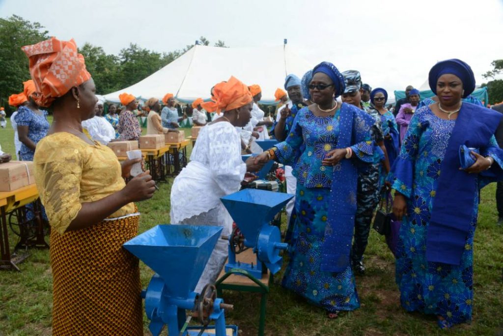 Wife of Ondo State Governor, Arabinrin Betty Anyanwu-Akeredolu (right), exchanging pleasantries with one of the beneficiaries, during the 6th Forum for Wives of Ondo State Officials, (FOWOSO) Empowerment Outreach Programme for Women, Youths and Special needs people in Akure North Local Government Area of Ondo State. 21st, June, 2018. 