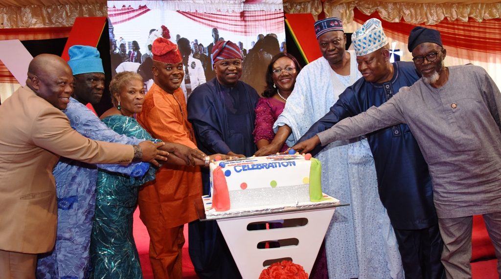 Lagos State Governor, Mr. Akinwunmi Ambode (middle); Head of Service, Mrs. Folasade Adesoye (4th right), her husband, Mr. Jide Adesoye (3rd right); Chairman, Local Government Service Commission, Mr. Babatunde Rotinwa (2nd right); Chairman, Audit Service Commission, Alhaji Waliu Abiodun Onibon (right); member, Lagos State House of Assembly, Hon. Adedayo Famakinwa (4th left); Chairman, Civil Service Commission, Mrs. Taiwo Oyemade (3rd left); Chairman, Commissioner II, Civil Service Commission, Hon. Wasiu Tolani Odeyemi (2nd left) and Chairman, Health Service Commission, Dr. Bayo Aderiye (left), during the cutting of the cake at a special dinner in honour of outstanding Public Servants in the State at Lagos House, Alausa, Ikeja