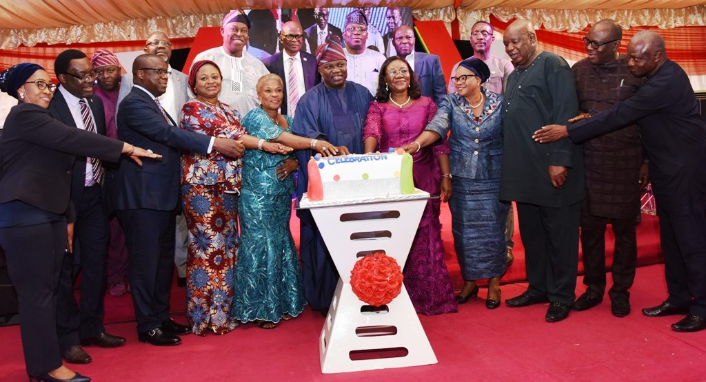 Lagos State Governor, Mr. Akinwunmi Ambode; flanked by Head of Service, Mrs. Folasade Adesoye (5th right), Chairman, Civil Service Commission, Mrs. Taiwo Oyemade (5th left) and some members of the State Executive Council during the cutting of the cake at a special dinner in honour of outstanding Public Servants in the State at Lagos House, Alausa, Ikeja