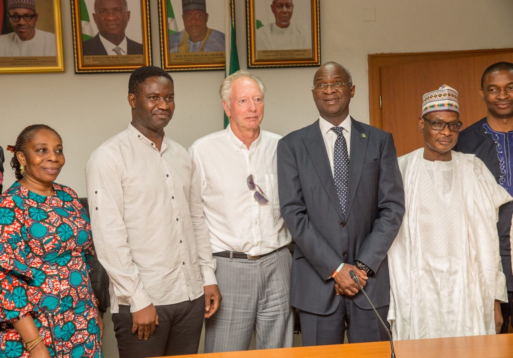  Hon. Minister of Power, Works & Housing, Mr Babatunde Fashola, SAN (3rd right), Permanent Secretary, Works & Housing, Mr Mohammed Bukar(2nd right), Director Human Resource, Mrs Morayo Alimi (left),former Assistant Technical Adviser of the Super Eagles, Bonfrere Jo(3rd left) and former Super Eagles player, Benedict Akwuegbu (2nd left) in a group photograph shortly after the handing over of the keys of the Federal Government allocated House to the Coach in fulfillment of Government's Pledge 24 years ago for Winning the 1994 African Cup of Nations at the Ministry of Power,Works & Housing Headquarters, Mabushi, Abuja on Tuesday 5th, June 2018. 