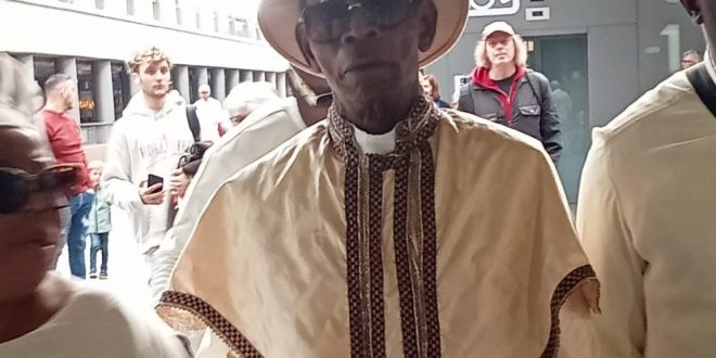 REVEREND E.M.F. OSHOFFA ARRIVES ANTWERP, BELGIUM…Expresses Shock At The Demise Of VSE V.B. Williams